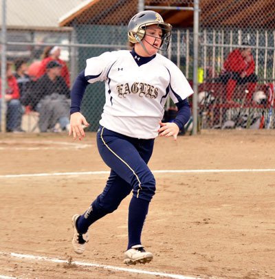 Lauren Salcedo/Staff Photo Arlington’s Lynsey Amundson runs to first during the March 27 game against M-P.
