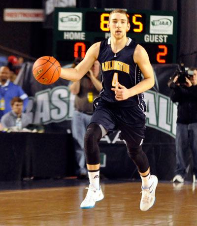 Arlington's Terry Dawn moves the ball down the court during the Eagles' 72-60 victory over Richland in the first round of the State Tournament on Feb. 28