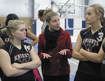 Highland Christian’s girls volleyball Head Coach Hannah Gould talks to her players during the Oct. 22 match against Grace Academy.