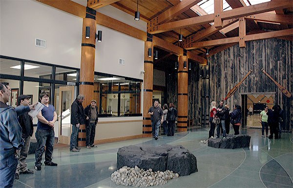 Visitors on the opening day of the new Stillaguamish Center look over the beautiful facility. Through the opening at right is a full-sized gymnasium.