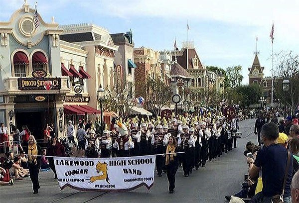 The Lakewood High School band marches down Main Street at Disneyland.