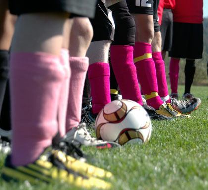 Cobras and Wildcats put their pink socks forward.