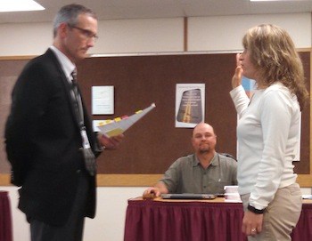Lakewood superintendent Michael Mack swears in new school board member Jahna Smith May 27.