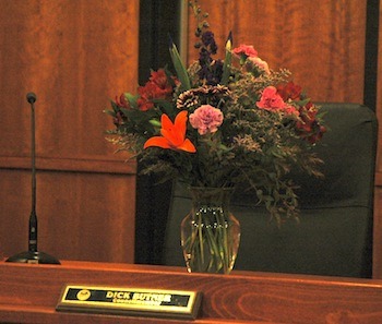 Arlington City Council member Dick Butner's empty chair was decorated with flowers on May 18.