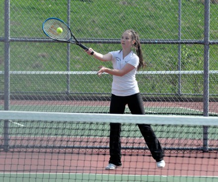 AHS junior Macy Mackey plays a tough match against Monroe’s Leanna Heit during an away game on May 1.