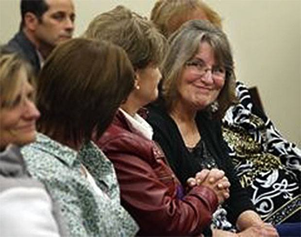 Nancy Stensrud smiles at family after Danny Giles was found guilty Oct. 20 in Snohomish County Superior Court in the 1995 murder of Patti Berry of Arlington.