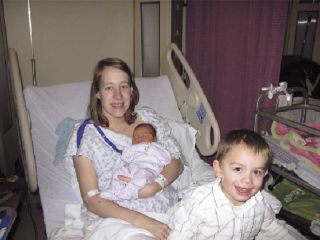 Robin Cole Cortes holds the first baby of the year