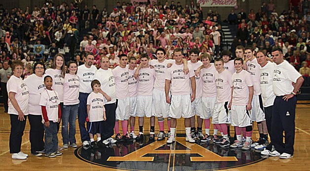 The Eagles basketball team is joined by their coaches and friends during last yearâ€™s Coaches vs. Cancer game.