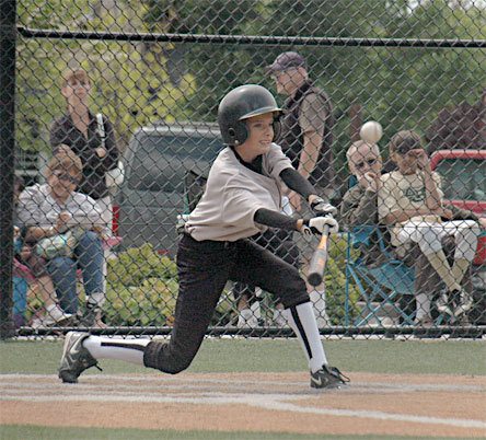 Shortstop Jacob Arnold connects with the ball in the fourth inning for a single that kept a six-run scoring drive moving.