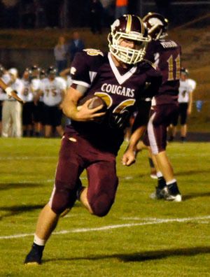 Cougars’ running back Donovan Evans scores his second touchdown of the night