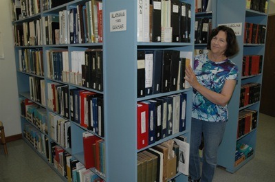 Stillaguamish Valley Genealogical Society Librarian Michele Heiderer invites visitors to browse through the group's more than 6