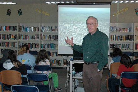 Dr. Jerry Rusher of Arlington talks about his recent volunteer efforts in Haiti for students at Post Middle School on Friday