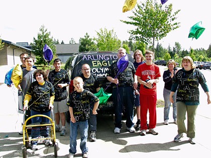 Arlington Special Olympians and organizers show off their T-shirts before heading to the Special Olympics Washington’s Summer Games 2010 in Ft. Lewis earlier this month.