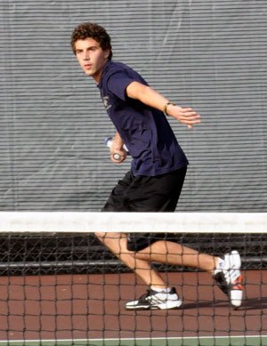 Arlington singles player Connor Ghirardo competes against Snohomish’s Jory Strickland in an away match on Oct. 9.