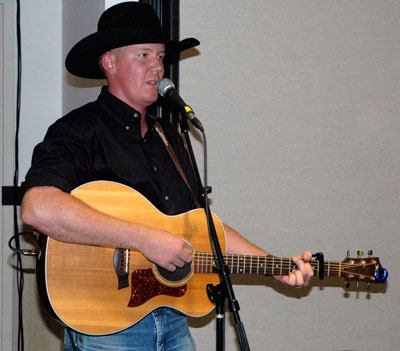 Arlington’s Jesse Taylor performs at the Arlington-Smokey Point Chamber of Commerce Black & White Gala on Sept. 21.
