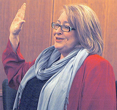 Barbara Tolbert takes the oath of office again as Arlington's mayor.