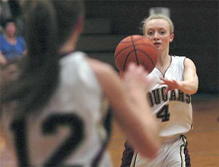 Lakewood junior Natalie Raymond leads a fast break by passing the ball to open teammate Jordan Wessell for a jump shot.