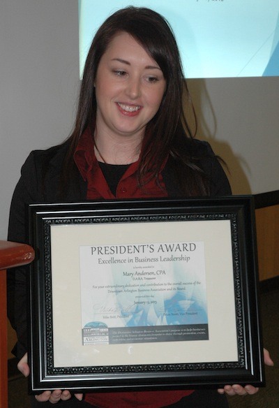 Mary Anderson shows the President’s Award certificate she received from DABA President Mike Britt for her inspirational volunteer work