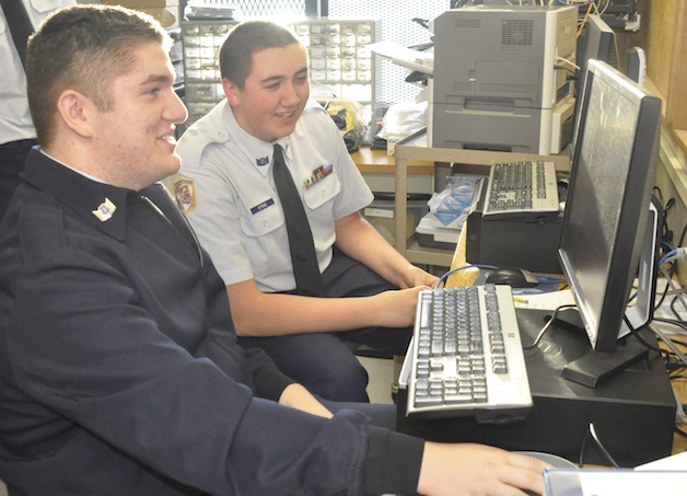 Arlington High School Air Force Junior ROTC cadets Cody Barschaw and Thomas Strine practice for the upcoming round of CyberPatriot competitions.