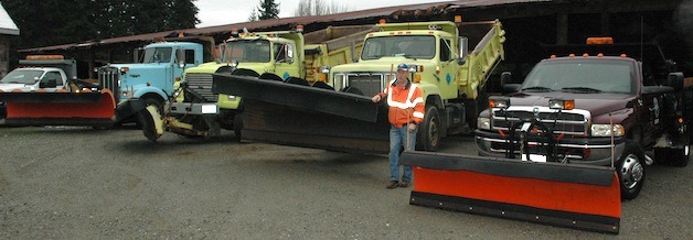 Public works maintenance and operations truck driver Dan 'Oly' Bardell shows off the city's fleet of snow-clearing vehicles.