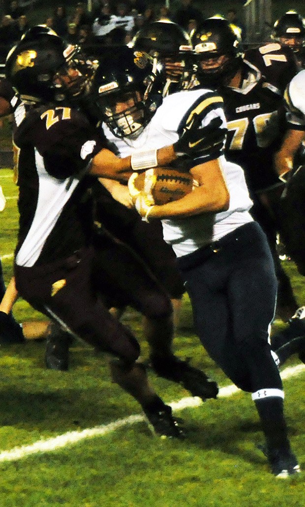 Lakewood's Sean Dawson makes the tackle.