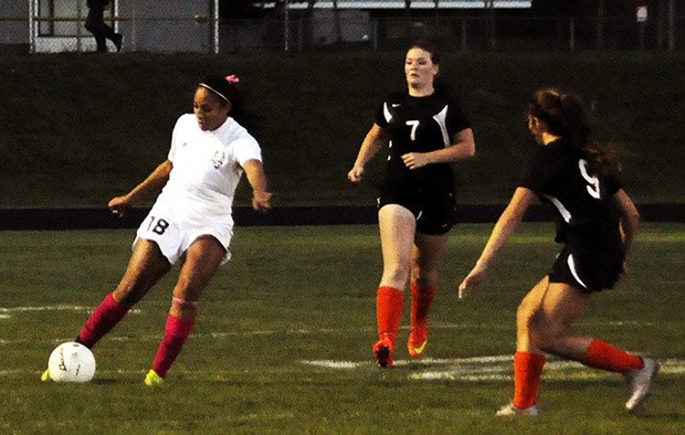 Cyera Charles of Lakewood keeps the ball away from Granite Falls defenders.
