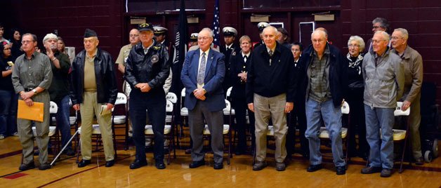 Veterans stand to receive a heroic recognition at Lakewood High School's Veterans Day assembly on Nov. 9.