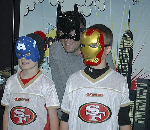 Dad Justin and boys Parker and Gage dress up as superheroes at the event.