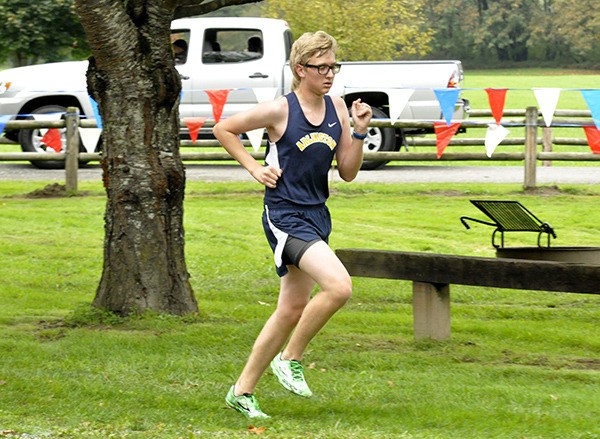 Arlington junior Quinn James competes in a cross country meet at River Meadows Park on Wednesday