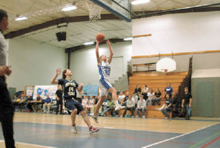 Grace freshman Sondra Cooper tries for an easy lay-up on a fast break. The 5-7 guard had four points in the loss.
