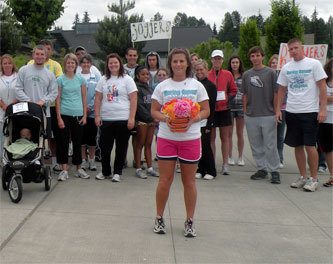 Christie Stensland stands in front of about 50 participants in her “Curing Cancer - One Step At A Time” 5K walk and run to benefit Providence Regional Cancer Partnership.
