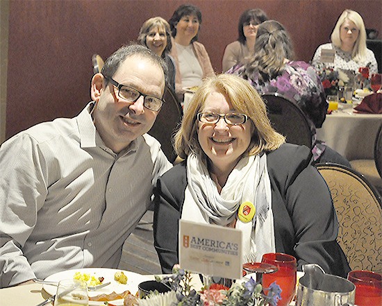 Darrington Mayor Dan Rankin and Arlington Mayor Barb Tolbert are all smiles after finding out Wednesday that their towns have advanced into the Top 15 in the America's Best Communities competition.