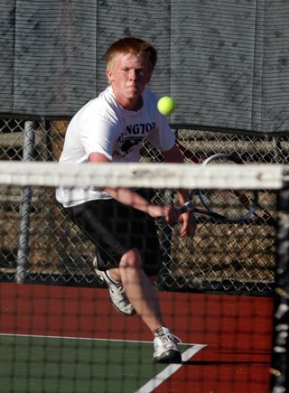 Jake Prunier plays his backhand on the run in the title match of the Wesco North divisional tournament. The two lost