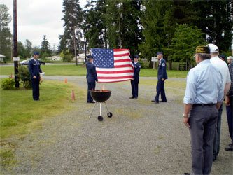 A flag is decommissioned during last year’s ceremony.