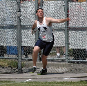 Arlington’s Dan Boyden throws the discus during the state championship meet