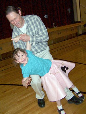 Eric and Abby Stevenson are all smiles at the May 30 ‘He and Me’ sock-hop