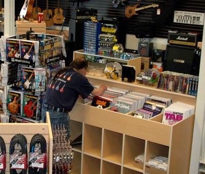 A customer browses through guitar and bass tablature books at Big Foot Music June 1.