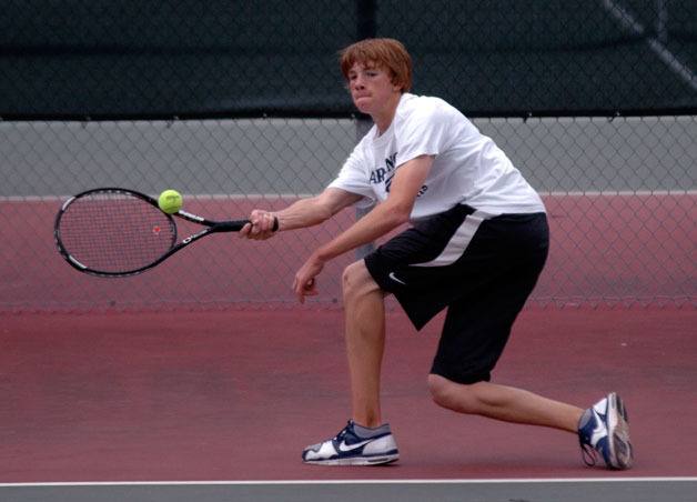 Arlington No. 1 singles player Austin Taylor hits a forehand during the Lake Stevens match.