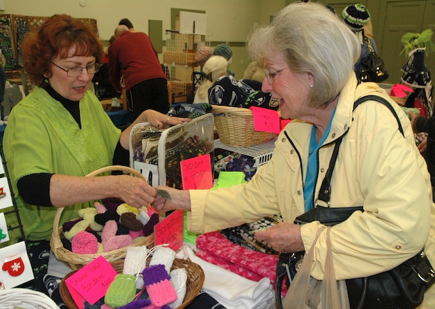 Marysville's Lynda Lindstrom sells some of her 'Accessories by Lynda' to Francie Skalsky.