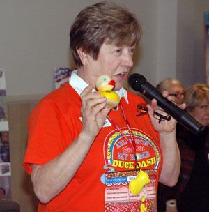 Arlington Rotary President Linda Byrnes reminds Arlington-Smokey Point Chamber of Commerce members of their ability to influence the community to help support the 25th annual Great Stilly Duck Dash.