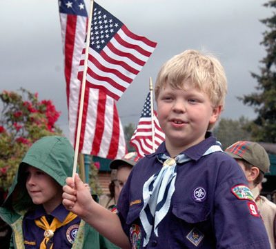 A Boy Scout walks down North Olympic Avenue on May 31 during the annual Memorial Day Parade. The parade