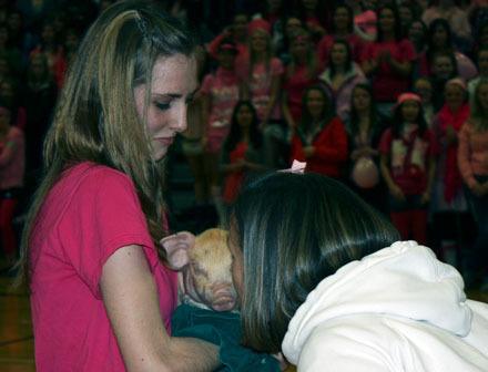 Vonni Walker to give it a quick smooth during the AHS Future Farmers of America chapter’s “Kiss a Pig” fundraiser Jan. 7