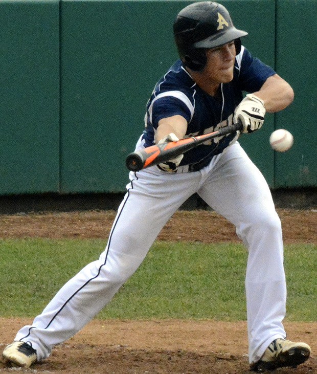 Arlington's Daniel Smith lands a bunt in the Eagles win over Marysville-Pilchuck May 14.