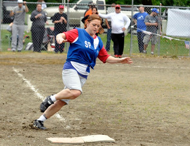 Eliza Malmberg of the North Counties Christian Sports Fellowship Leagueâ€™s West All-Stars team rounds first base during the running portion of the fifth annual All-Star Game and skills competition. Malmberg captured first place in the womenâ€™s running competition with a time of 14.76.