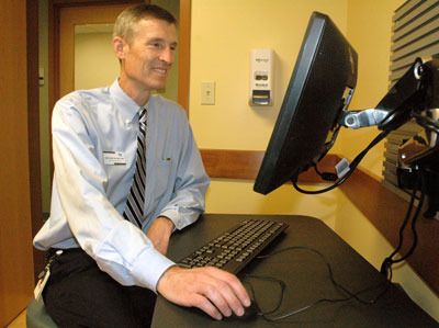 Dr. Tom Tocher can check patientsâ€™ medical records electronically from any of the exam rooms of the Community Health Center of Snohomish County in Arlington.