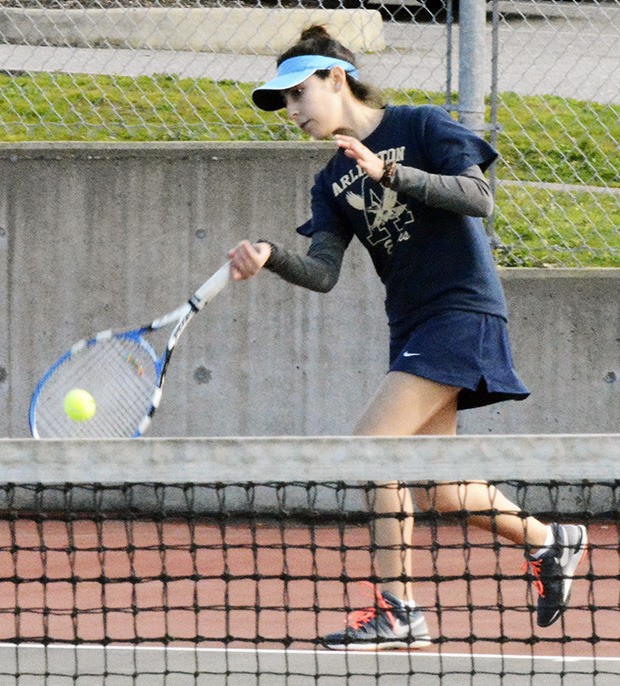 An Arlington singles player keeps the ball in play in a recent tennis match.