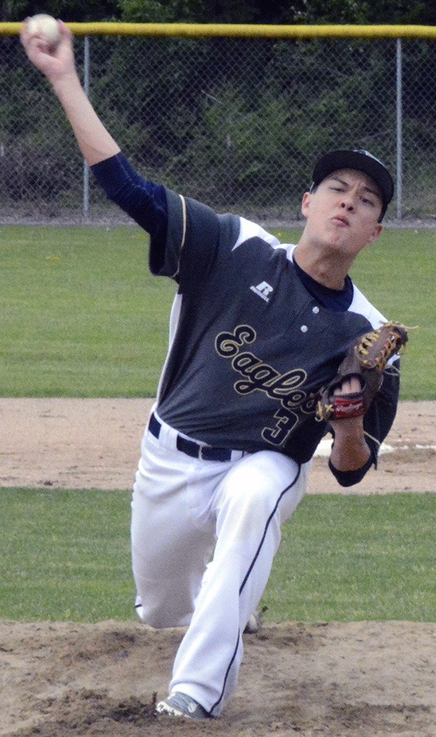 An Arlington player delivers a pitch.