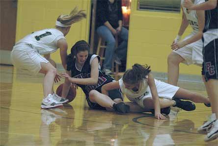 Freshman guard Amy Zimmerman jumps on a loose ball in the second half.