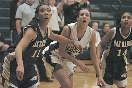 Post Ginny Wilson fights for one of her six rebounds against Oak Harbor’s Nicole Mowbray