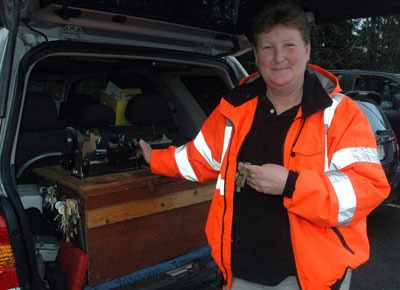 Arlington locksmith Anna Fouts shows off the equipment trunk inside the trunk of her Ford Escape that serves as her ‘office on wheels’ for 24-hour emergency service calls throughout Arlington